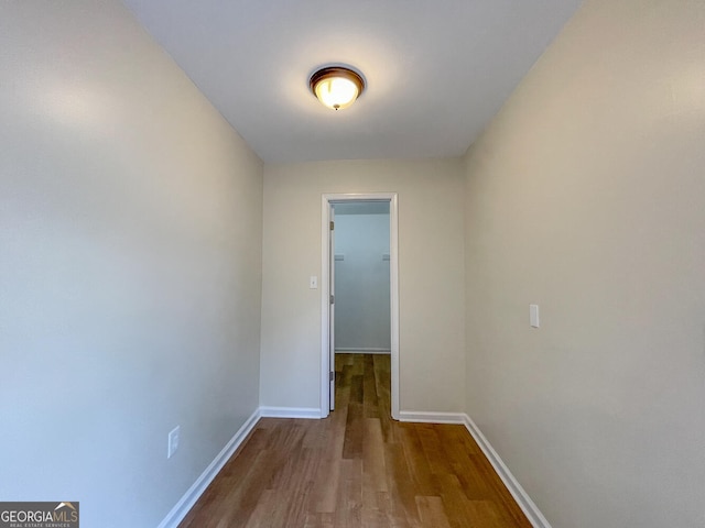 corridor featuring hardwood / wood-style floors