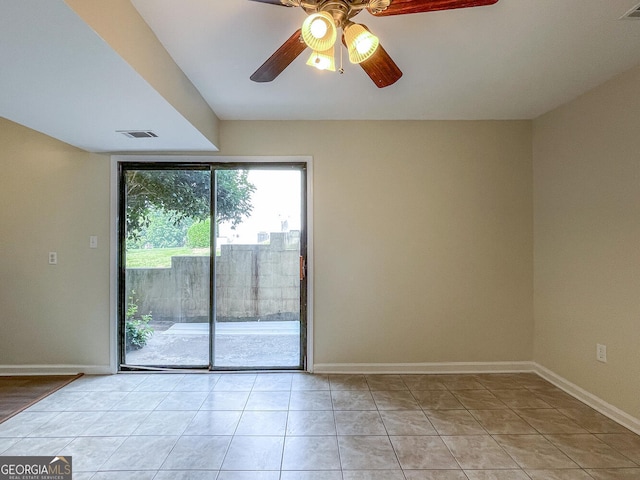 unfurnished room featuring ceiling fan and light tile patterned flooring