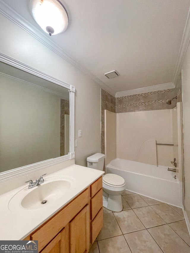 full bathroom featuring vanity, bathing tub / shower combination, tile patterned floors, crown molding, and toilet