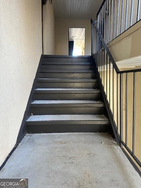 stairs with concrete floors