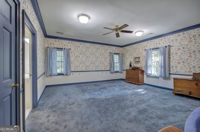 unfurnished bedroom with ceiling fan, ornamental molding, and multiple windows