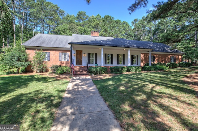 single story home featuring a front yard and covered porch