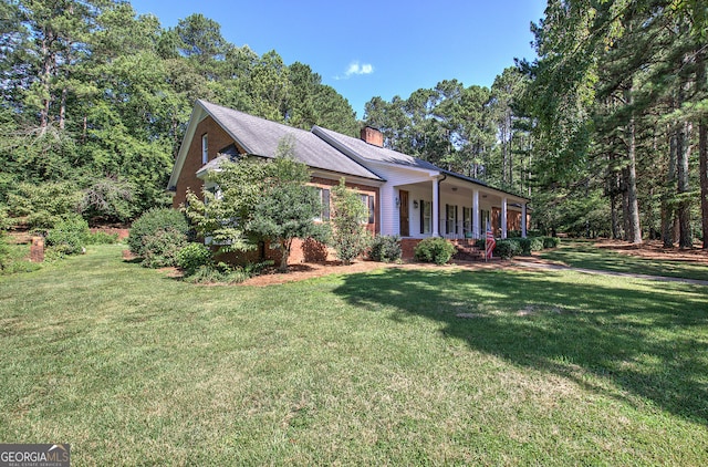 view of front of home with a front yard and a porch