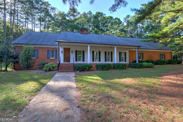 single story home with a front yard and a porch