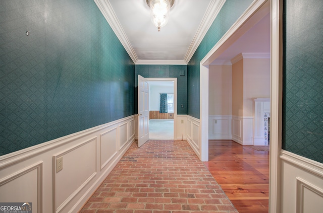 hallway featuring crown molding and light wood-type flooring