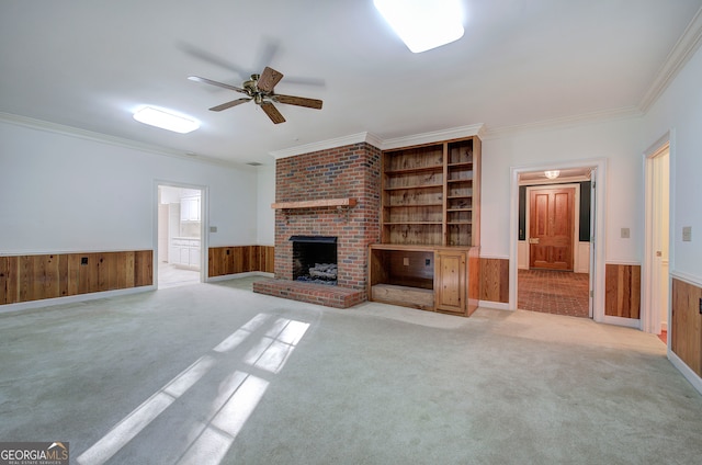 unfurnished living room featuring light carpet, crown molding, and wood walls