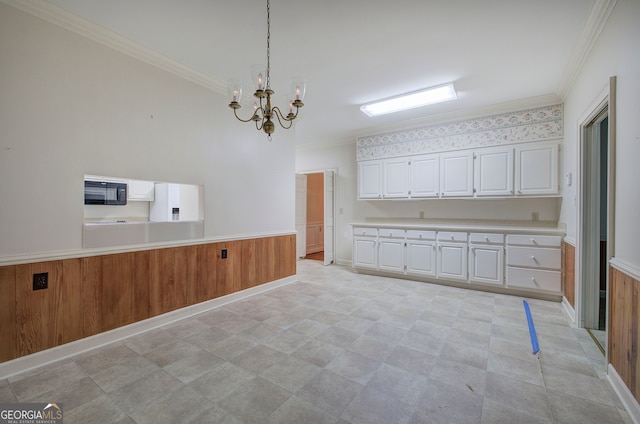 kitchen with ornamental molding, white cabinetry, decorative light fixtures, and white fridge with ice dispenser