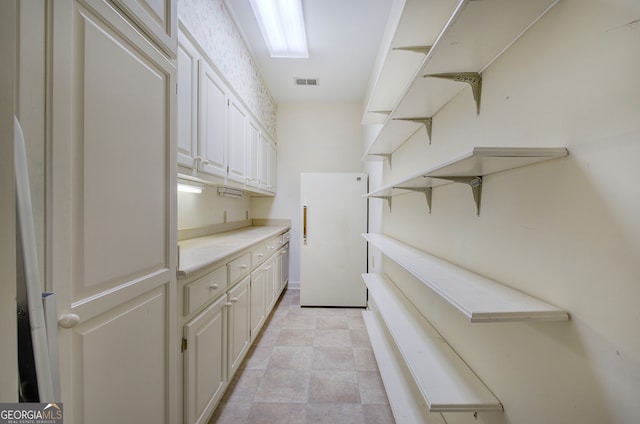 interior space featuring white cabinetry