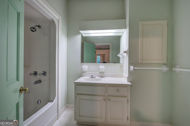 bathroom featuring vanity, washtub / shower combination, and tile patterned floors