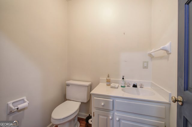 bathroom with vanity and toilet