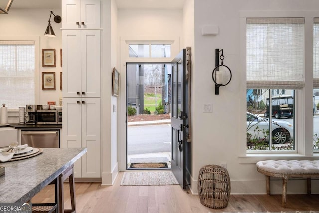 entrance foyer featuring light hardwood / wood-style floors