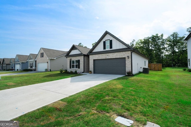 view of front of property with a garage, a front lawn, and central air condition unit