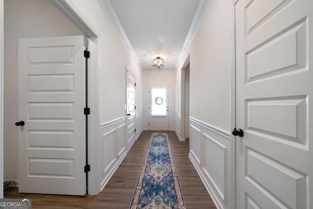 entryway with dark hardwood / wood-style flooring and ornamental molding