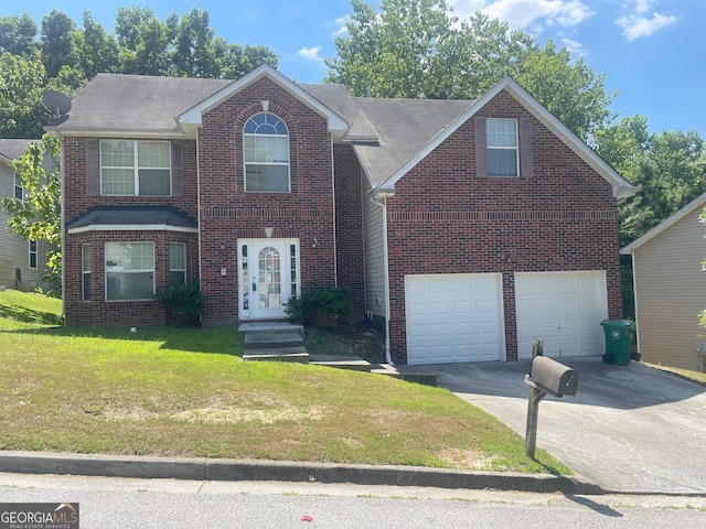 view of front facade with a garage and a front yard