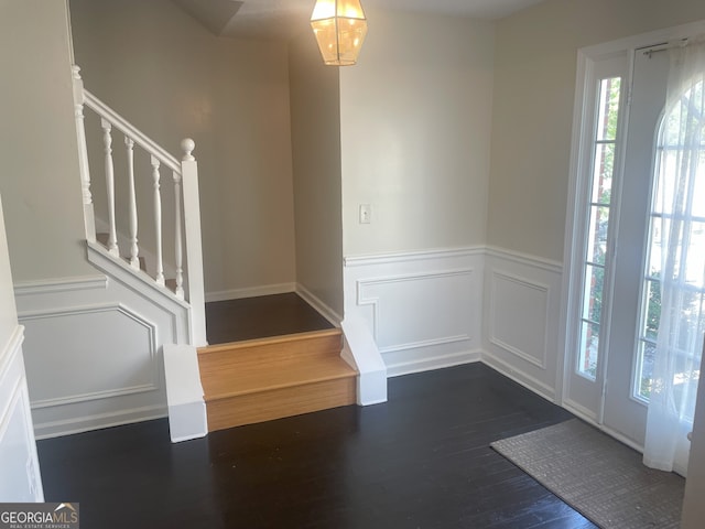 entrance foyer with dark hardwood / wood-style flooring