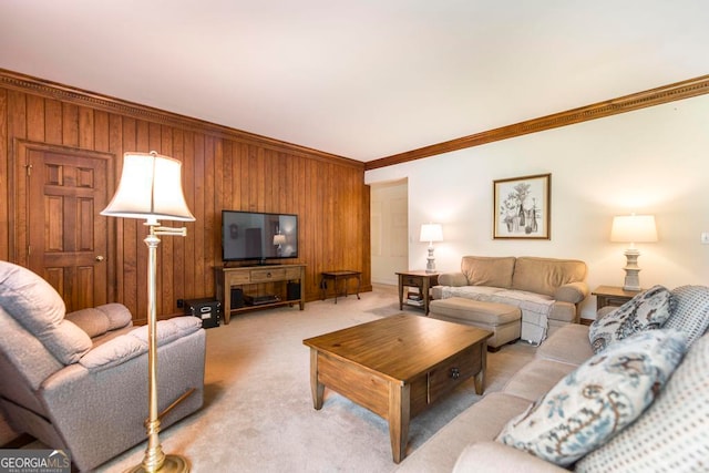 carpeted living room featuring crown molding and wooden walls