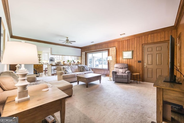 101 Huntington Dr, Dublin, GA 31021 - living area with light carpet, crown molding, and ceiling fan