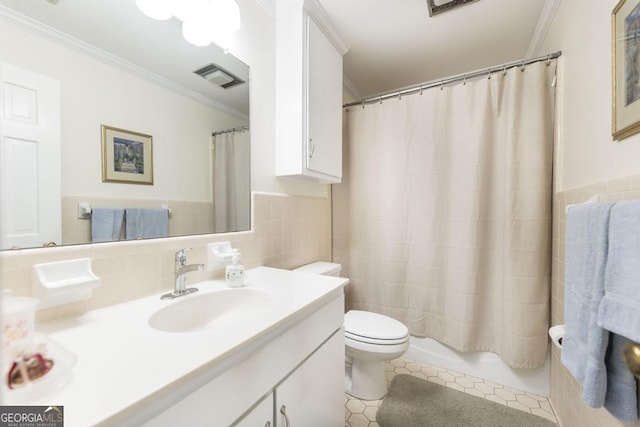 101 Huntington Dr, Dublin, GA 31021 - bathroom with ornamental molding, toilet, tile walls, and visible vents