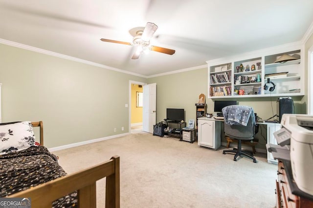 carpeted bedroom featuring crown molding and ceiling fan