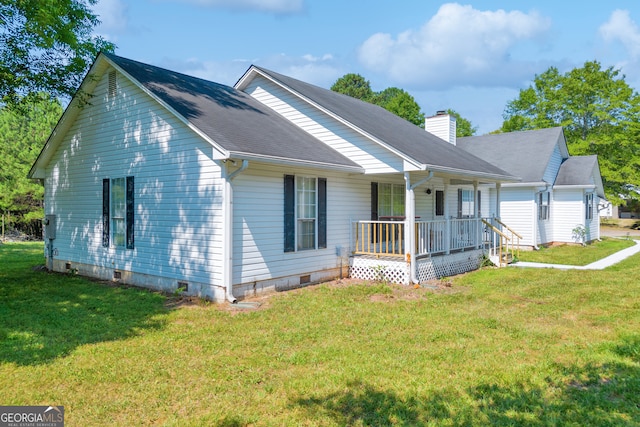 view of front of home with covered porch and a front yard