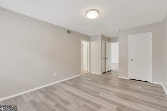 unfurnished bedroom with light hardwood / wood-style floors