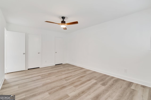 unfurnished bedroom featuring ceiling fan and light wood-type flooring