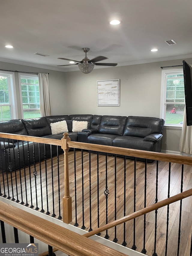 living room with wood-type flooring and ceiling fan