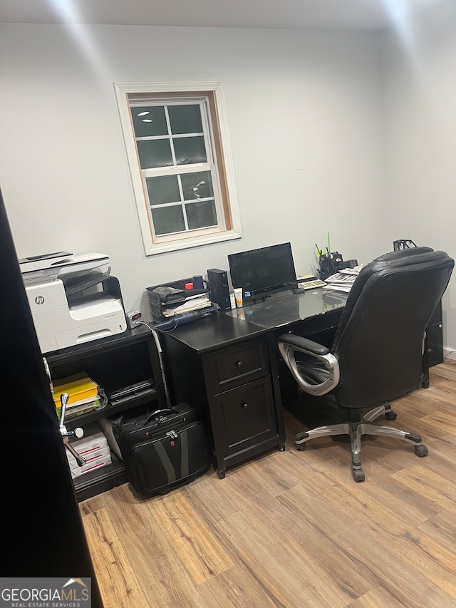 office area with light hardwood / wood-style flooring