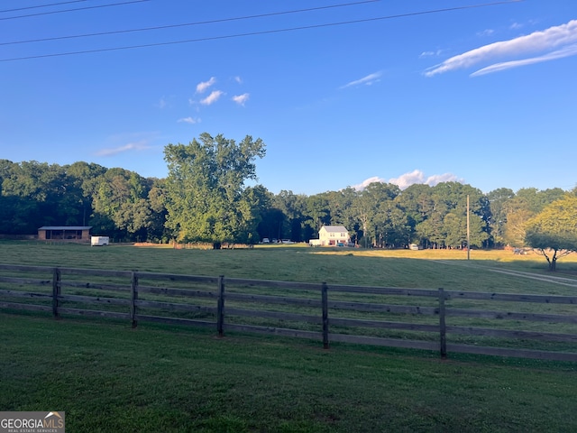 view of yard with a rural view