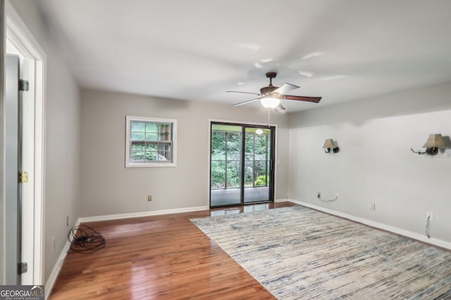 spare room featuring ceiling fan and hardwood / wood-style floors