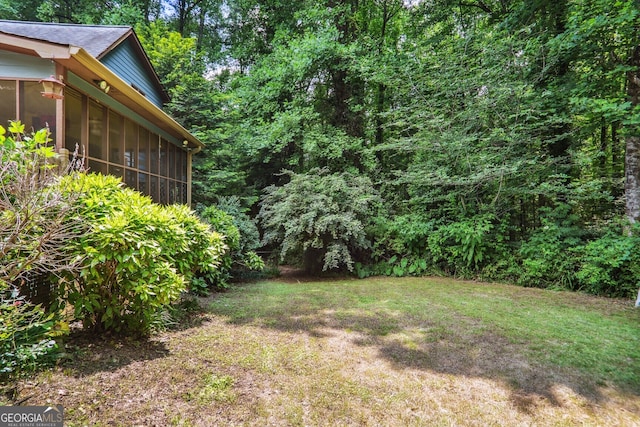 view of yard featuring a sunroom