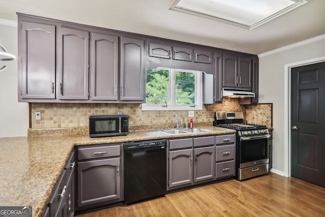 kitchen featuring black appliances, crown molding, sink, light hardwood / wood-style flooring, and decorative backsplash