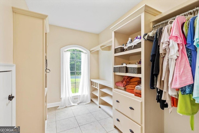 walk in closet featuring light tile patterned floors