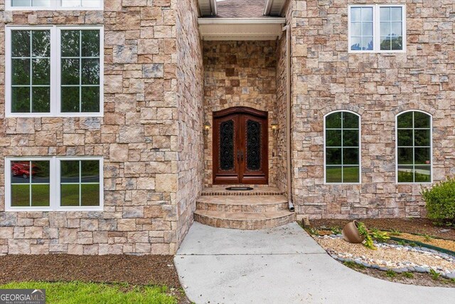 doorway to property with french doors