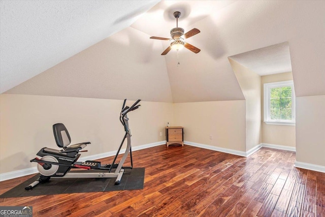 workout room with lofted ceiling, ceiling fan, a textured ceiling, and hardwood / wood-style floors