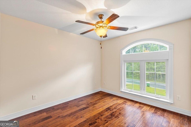 spare room with ceiling fan and hardwood / wood-style floors