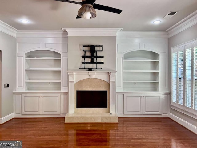 unfurnished living room featuring ornamental molding, ceiling fan, and light wood-type flooring