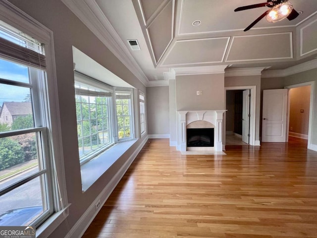 unfurnished living room with ceiling fan, light hardwood / wood-style floors, and crown molding