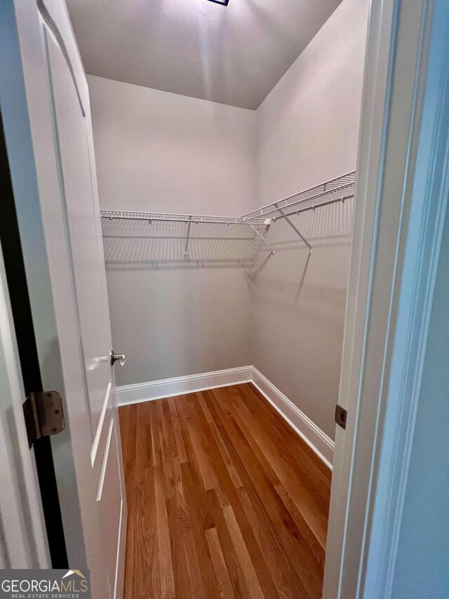 spare room featuring ornamental molding, wood-type flooring, and ceiling fan