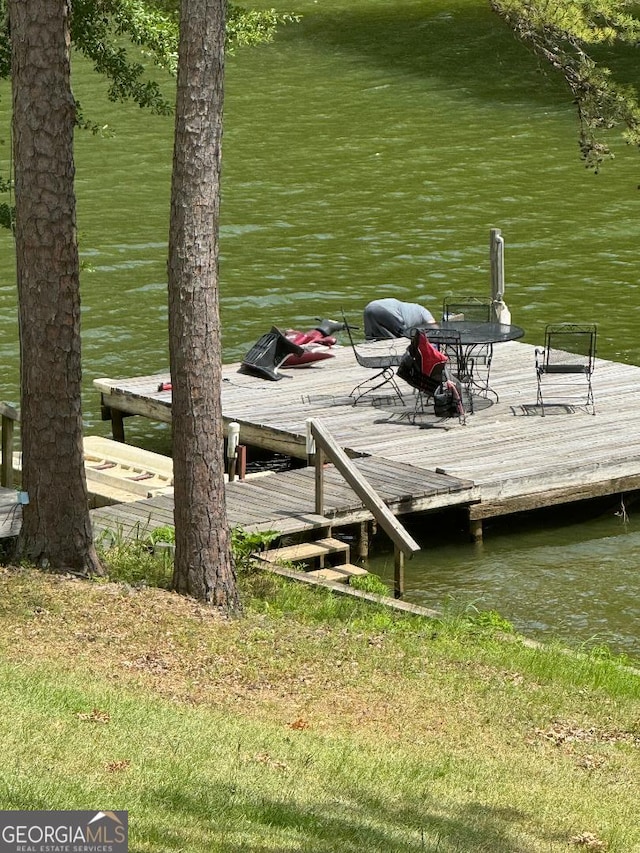 view of dock with a water view