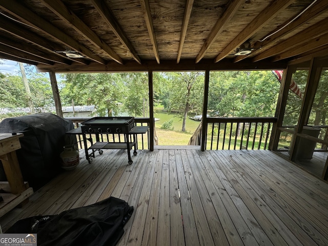 wooden terrace featuring area for grilling