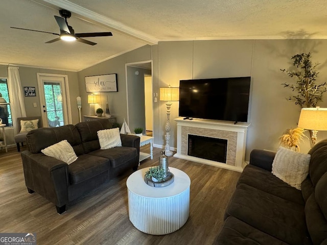 living room featuring a textured ceiling, vaulted ceiling with beams, hardwood / wood-style floors, and ceiling fan