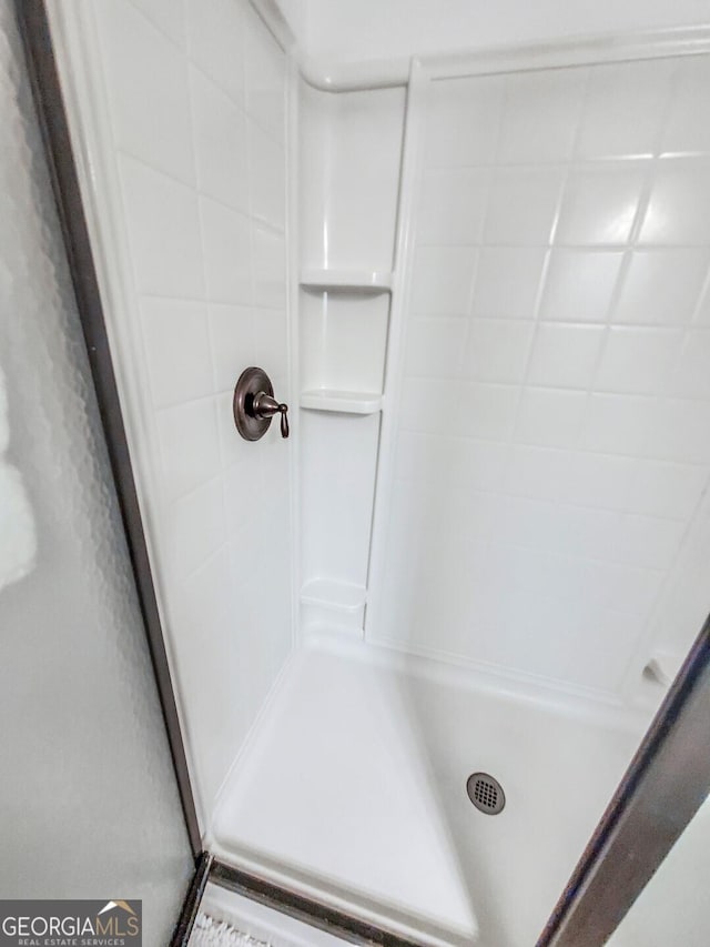 bathroom featuring walk in shower