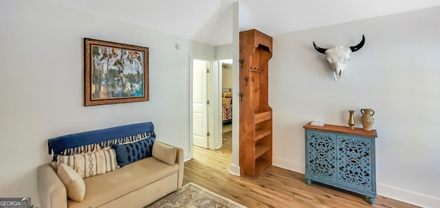 sitting room with wood-type flooring