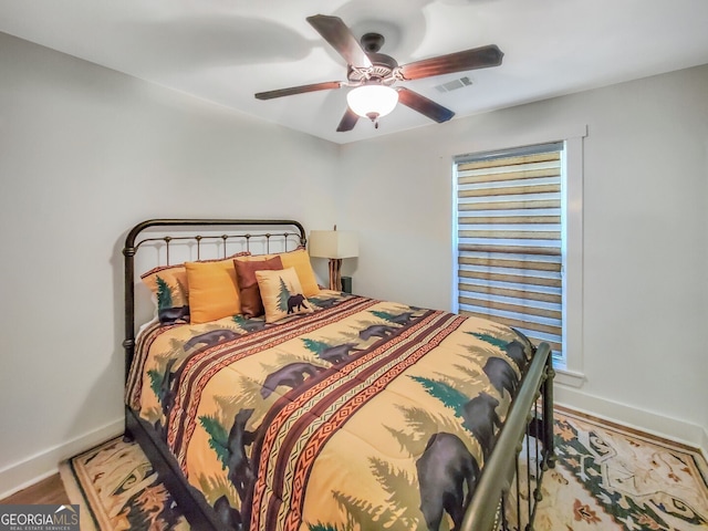 bedroom featuring wood-type flooring and ceiling fan