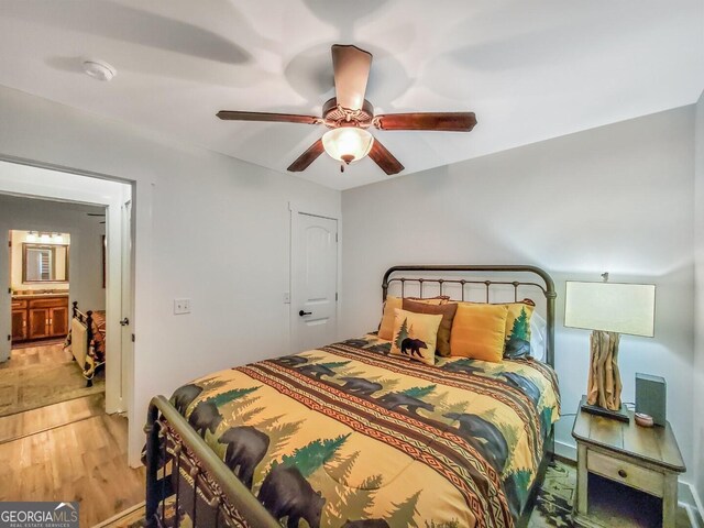 bedroom with wood-type flooring and ceiling fan