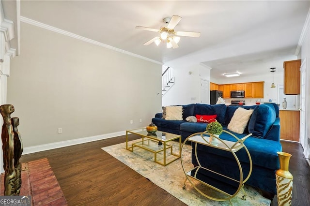 living room featuring ceiling fan, ornamental molding, and hardwood / wood-style floors