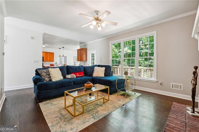 living room with ceiling fan, dark wood-type flooring, and crown molding