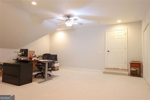 carpeted home office featuring ceiling fan