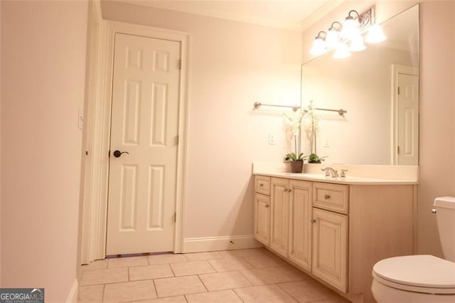 bathroom with tile floors, toilet, and vanity